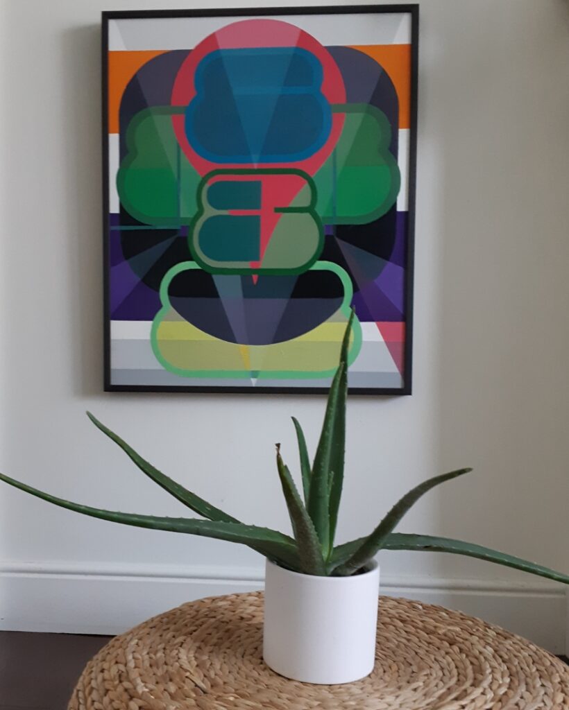 giant aloe plant with painting by Sarah Gee Miller in background